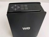 a remote control sitting on top of a black box