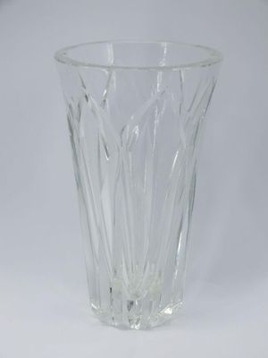 a clear glass vase on a white surface