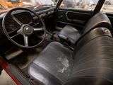dashboard of an old car with a steering wheel and a dash board