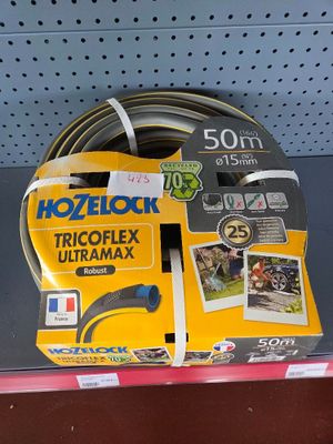 a close up of a hose on a shelf in a store
