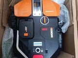a box with a lawn mower and other items in it