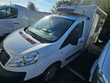 a white van that is parked in a parking lot