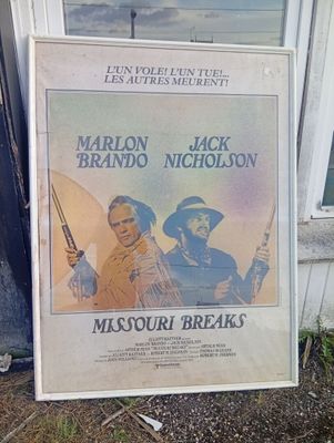 a large poster of a movie with a picture of two men