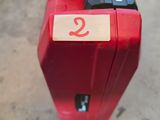 a red box with a number on it sitting on the floor