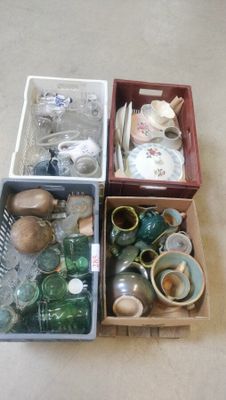 three boxes filled with various items on the floor