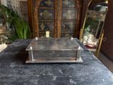 a small metal object sitting on top of a table