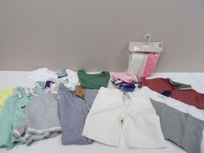 a lot of clothes that are on a table