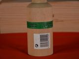 a bottle with a label on it sitting on a table
