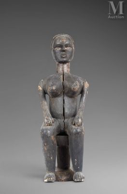 an image of a statue of a woman sitting on a stool