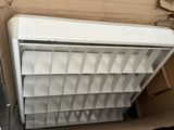 a white air conditioner sitting in a cardboard box
