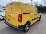 a yellow van that is parked in a parking lot