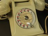 a white telephone that is sitting on a table
