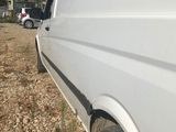 a white van parked on the side of the road