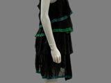 mannequin wearing a black dress with green trims on a mannequin