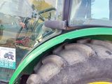 a tractor that is parked on the side of the road