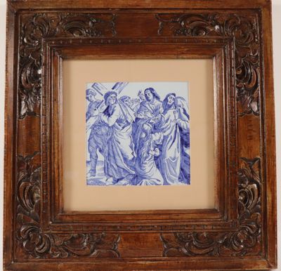 a framed picture of a blue and white picture of a group of people