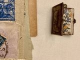a picture of a collection of old stamps on a wall