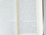 a open book on a table with a cup of coffee on it