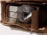 a cardboard box that has a bunch of items inside of it