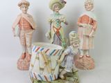 three figurines that are sitting next to each other