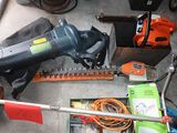 a picture of a corded hedger and other tools on the ground