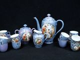 a group of blue and white teapots and cups