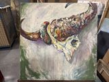 a painting of an elephant on a easel in a room