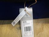 a blue bag with a price tag on it