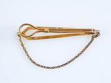 pair of scissors on a chain on a white background