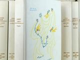 a white book with a drawing of a woman on it