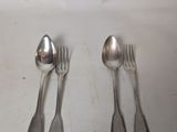 four spoons and two spoons sitting on a table
