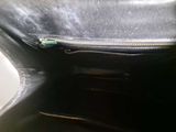 a black purse that has a zipper on it