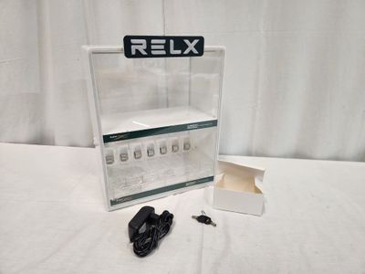 a box with keys and a remote on a table