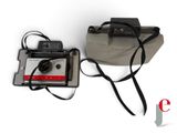 an old camera and an old camera on a white surface