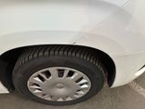 a white car that is parked in a parking lot