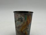a small cup that is sitting on a table
