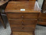 a wooden table with a drawer on top of it