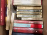 a box full of books that are sitting on a table