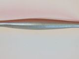 a metal handle that is on a white surface