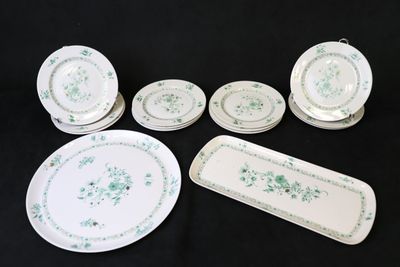 a lot of plates and trays that are sitting on a table