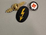 two badges that are on the table together