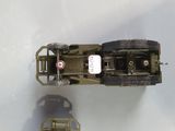 two toy vehicles that are sitting on a table