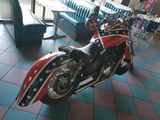 a red white and blue motorcycle on display in a restaurant