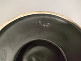 a close up of a black plate with a number on it