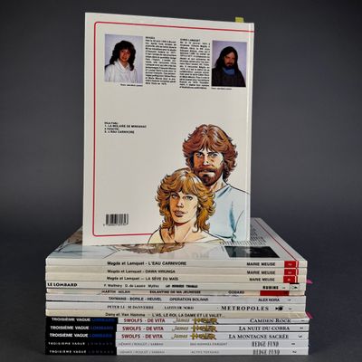 books stacked on top of each other on a gray surface