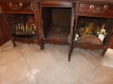 a wooden cabinet with two drawers and a mirror on it