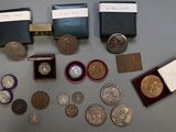 some coins and other coins are sitting on a table