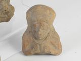 three pieces of stone sitting on top of a table next to each other