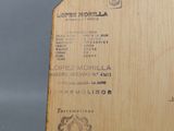 a wooden box with a label on it on a table