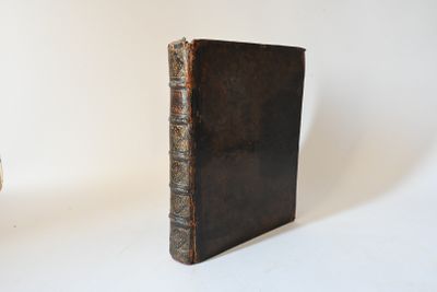 a small book sitting next to a small book on a table
